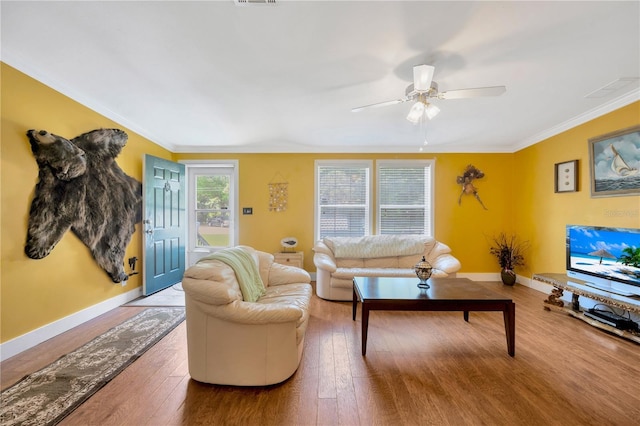 living room with ceiling fan, hardwood / wood-style floors, and crown molding