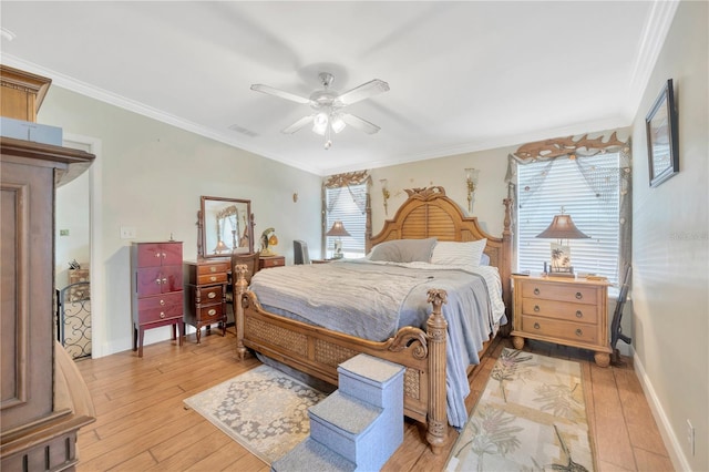 bedroom featuring ceiling fan, ornamental molding, and light wood-type flooring