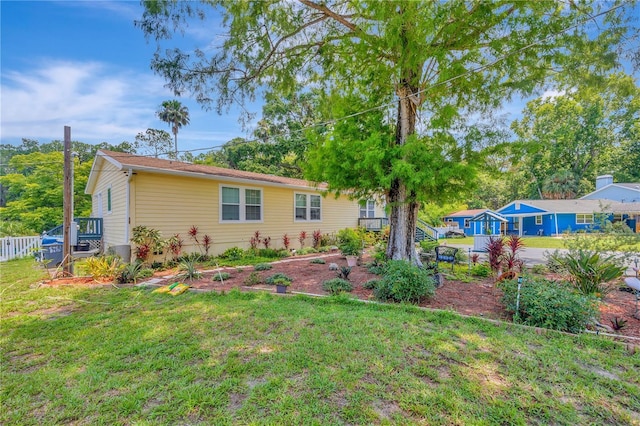 rear view of house with a lawn