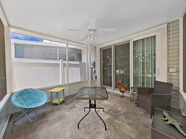 sunroom / solarium with ceiling fan