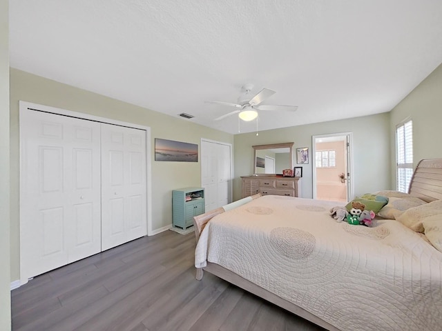 bedroom featuring ceiling fan, dark hardwood / wood-style flooring, and connected bathroom