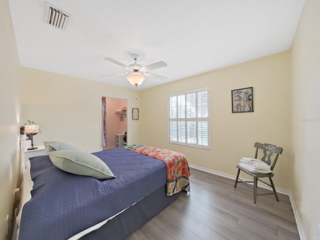 bedroom featuring hardwood / wood-style floors and ceiling fan