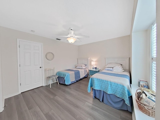 bedroom featuring ceiling fan and hardwood / wood-style flooring