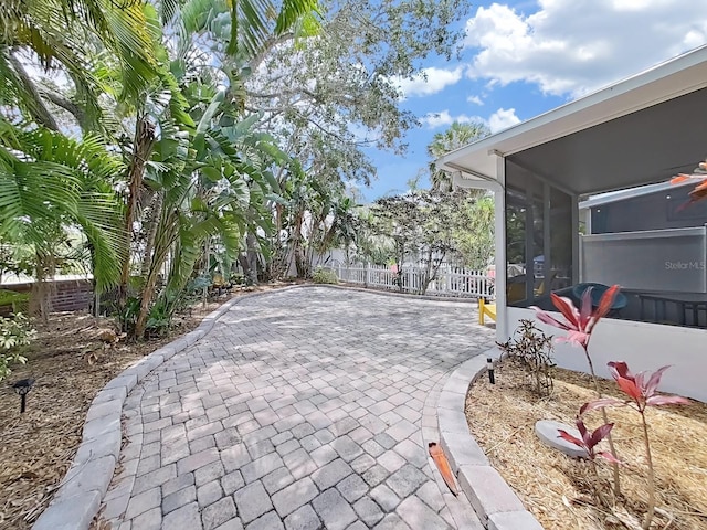 view of patio / terrace featuring a sunroom