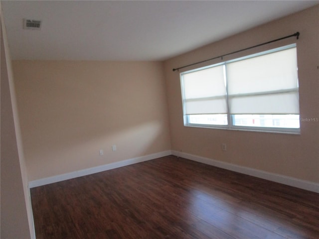 unfurnished room featuring dark hardwood / wood-style floors