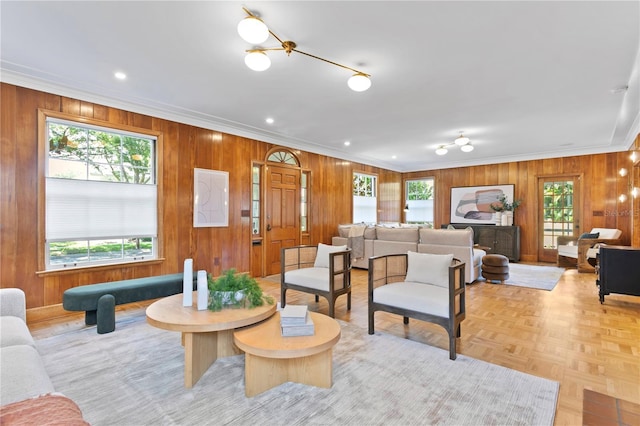 living room with light parquet flooring and crown molding