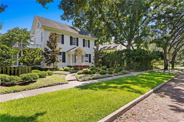 colonial home with a front yard