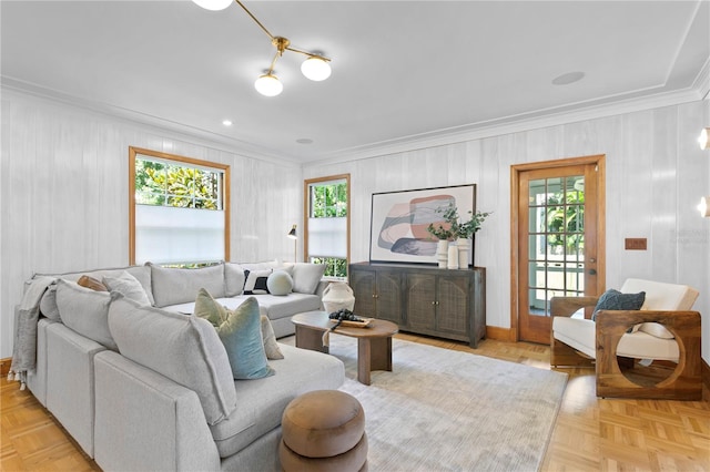 living room with ornamental molding and light parquet floors