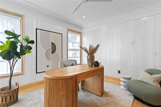 office area featuring crown molding, ceiling fan, and light hardwood / wood-style flooring