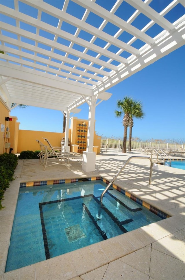 view of swimming pool with a pergola, a community hot tub, and a patio