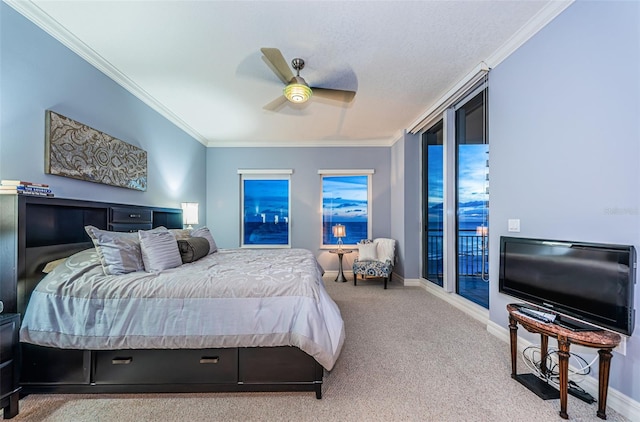 bedroom with crown molding, ceiling fan, access to exterior, and carpet floors