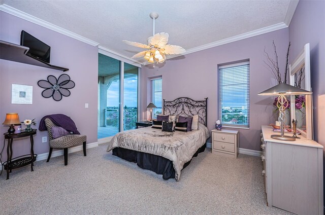 bedroom with carpet, ceiling fan, and multiple windows