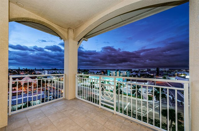 view of balcony at dusk