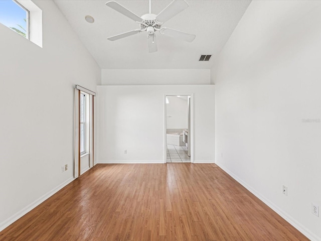 unfurnished room with ceiling fan and light hardwood / wood-style floors