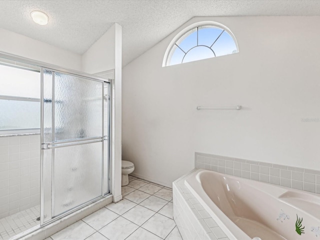 bathroom featuring plus walk in shower, tile patterned floors, vaulted ceiling, toilet, and a textured ceiling