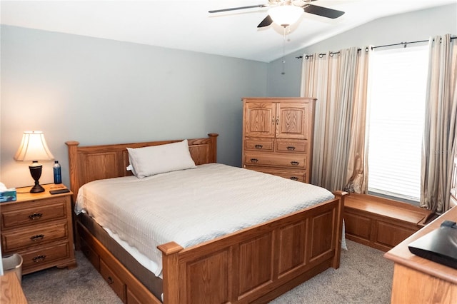 bedroom with light carpet, ceiling fan, and lofted ceiling