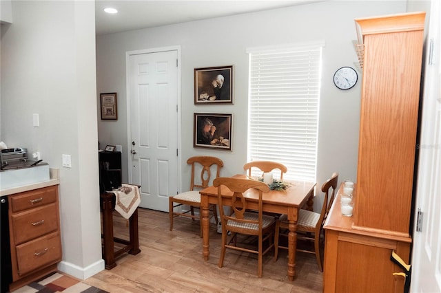 dining area featuring light wood-type flooring