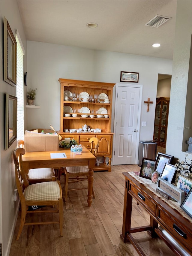 dining room with hardwood / wood-style floors