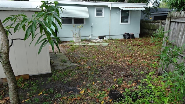 view of side of home with fence