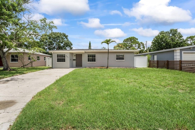 single story home with a front lawn