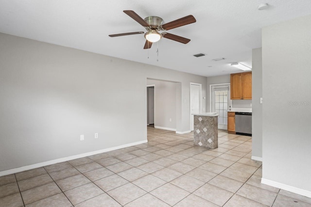 unfurnished living room with ceiling fan and light tile patterned floors