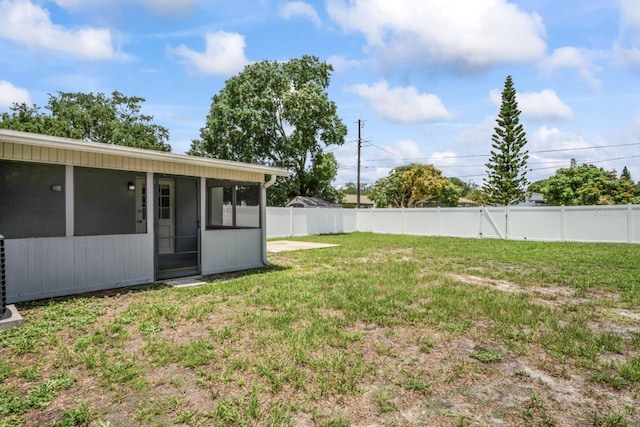 view of yard with a sunroom