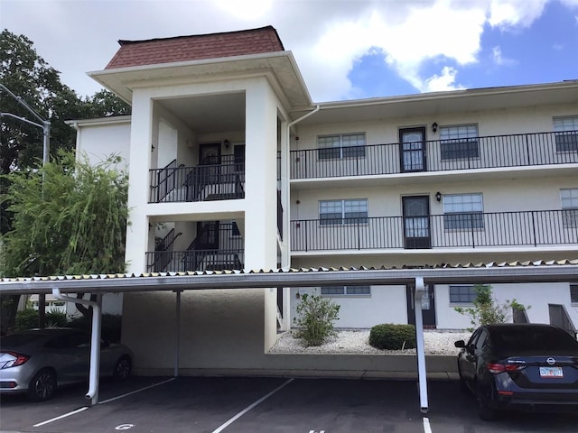 view of property featuring covered parking