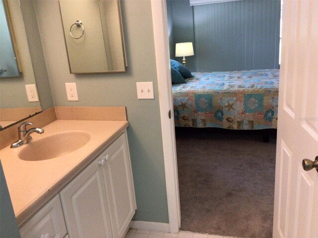 bathroom with tile patterned flooring and vanity