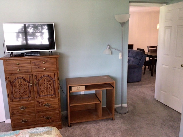 bedroom featuring light colored carpet