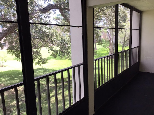 unfurnished sunroom featuring a wealth of natural light