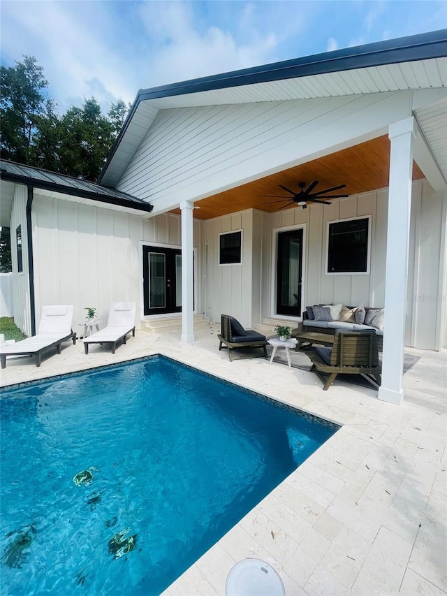 back of house with ceiling fan, outdoor lounge area, and a patio