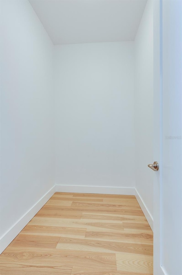 spare room with light hardwood / wood-style flooring