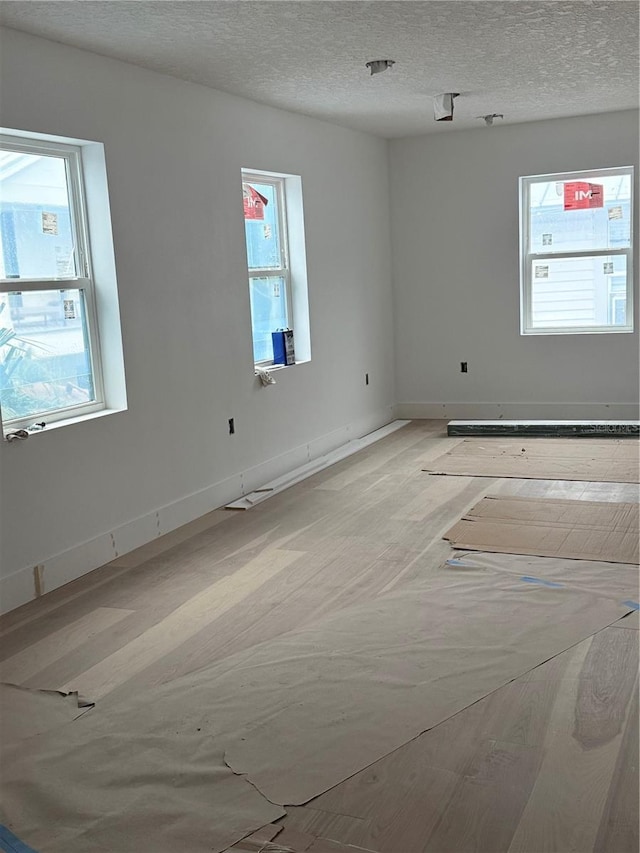 spare room featuring a textured ceiling