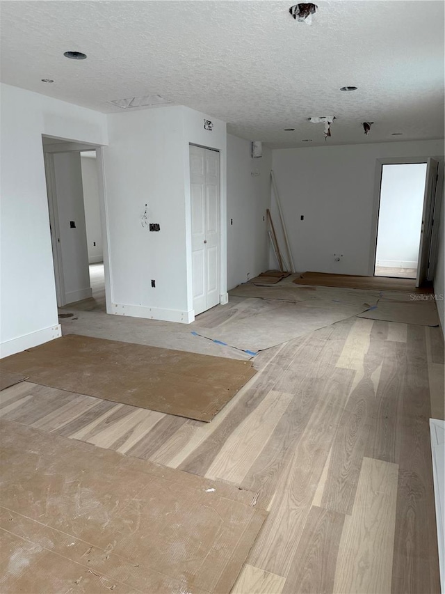 spare room with a textured ceiling