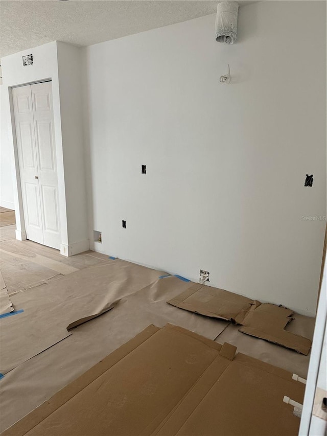 spare room featuring a textured ceiling