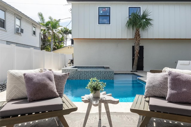 view of swimming pool featuring a fenced in pool, cooling unit, fence, and an in ground hot tub