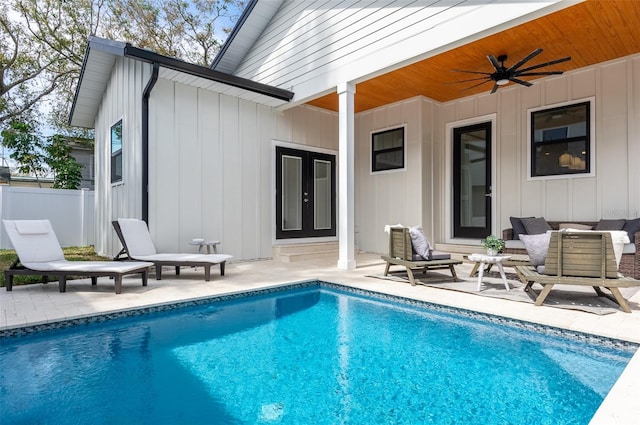 view of pool featuring ceiling fan, fence, a fenced in pool, and a patio