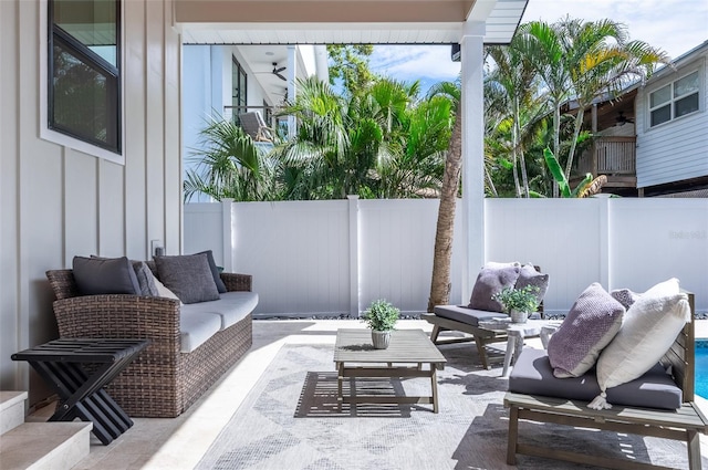 view of patio featuring fence and an outdoor living space