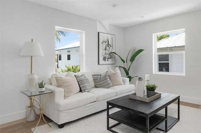 living room with light wood-style floors and baseboards