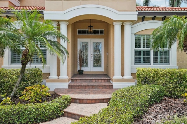 view of exterior entry featuring french doors