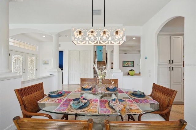 dining room featuring french doors and light tile patterned floors