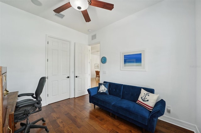 home office featuring dark hardwood / wood-style floors and ceiling fan