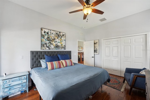 bedroom with ceiling fan, dark hardwood / wood-style floors, and a closet