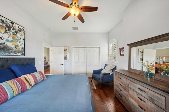 bedroom with a closet, ceiling fan, and dark wood-type flooring