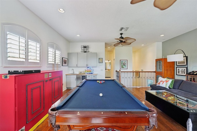 playroom featuring dark hardwood / wood-style floors, ceiling fan, and pool table