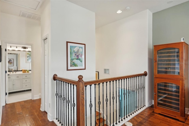 corridor with dark hardwood / wood-style flooring