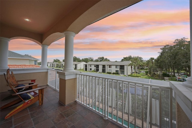 view of balcony at dusk