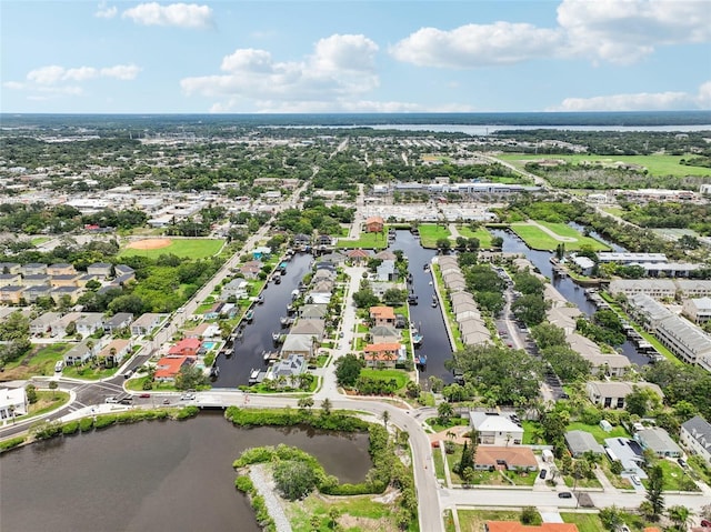 birds eye view of property featuring a water view