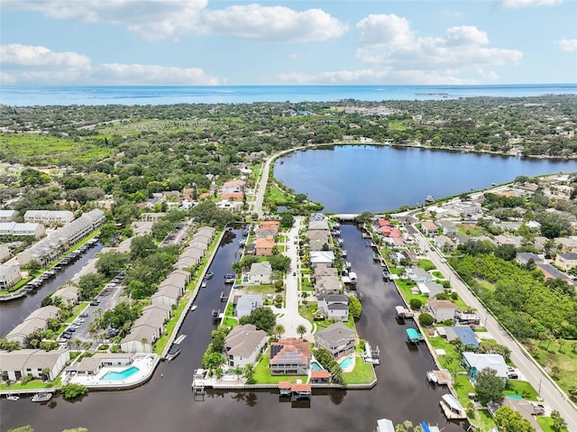 birds eye view of property featuring a water view