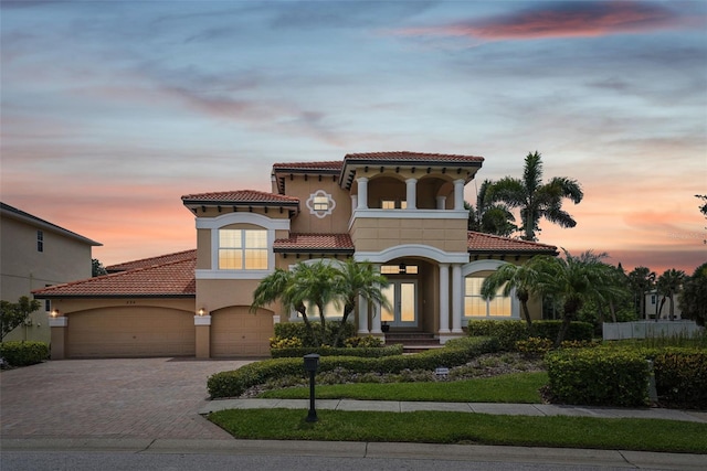 mediterranean / spanish-style home featuring a garage